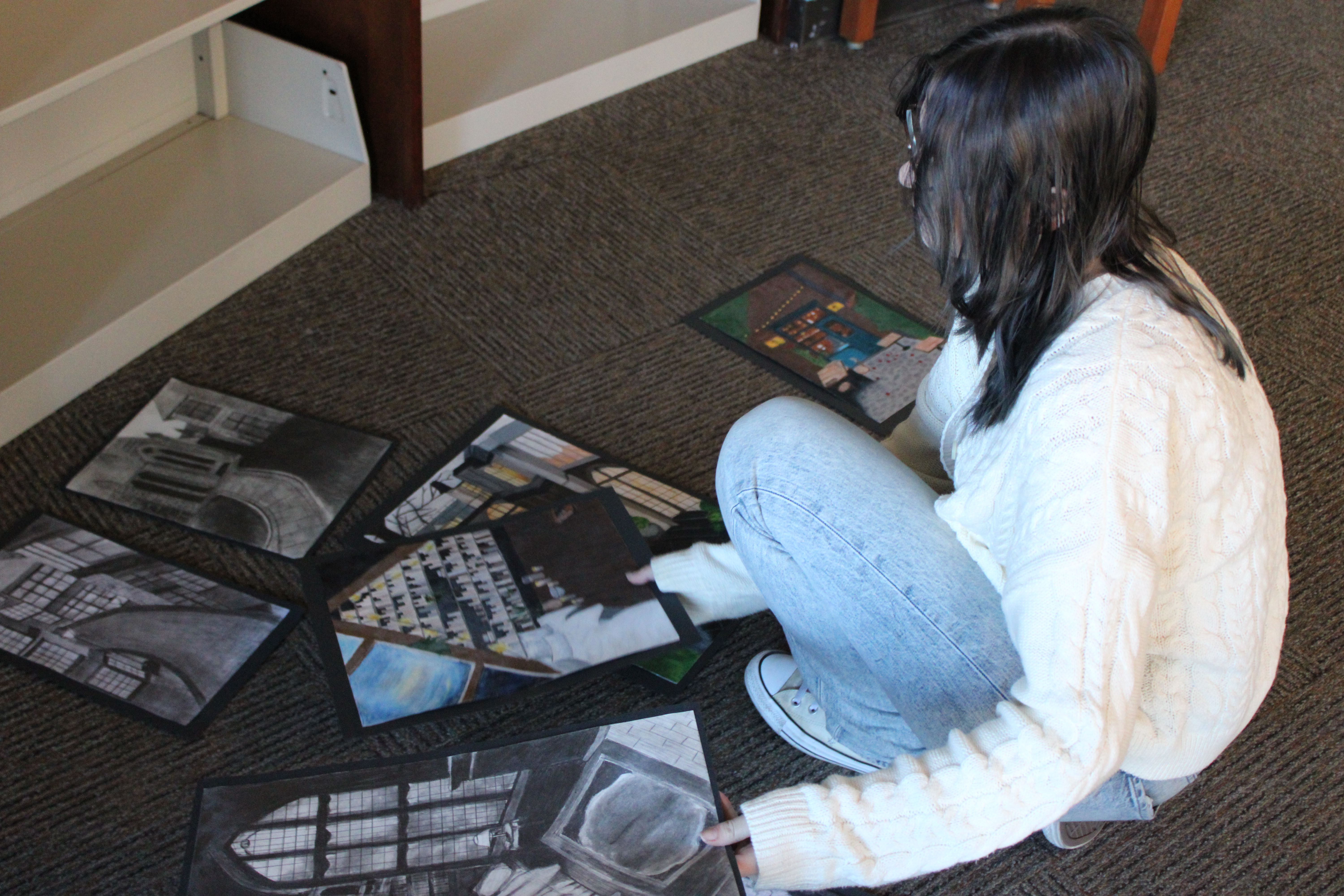 OK organizing her art for display