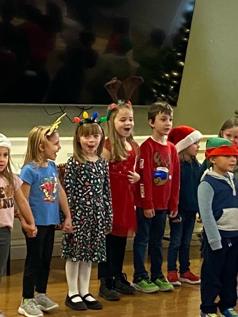 STUDENTS SINGING IN HOLIDAY CLOTHING