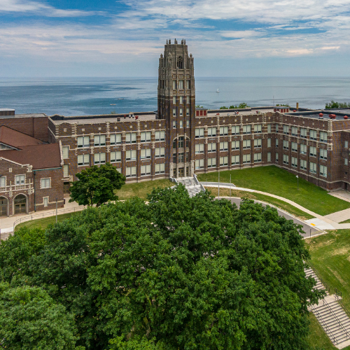 Aerial view of Lincoln High School in summer with Lake Michigan in the background