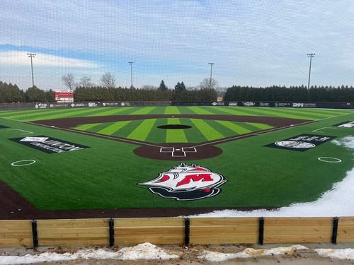Steinbecker Field on a snowy day with the Ships logo behind home plate