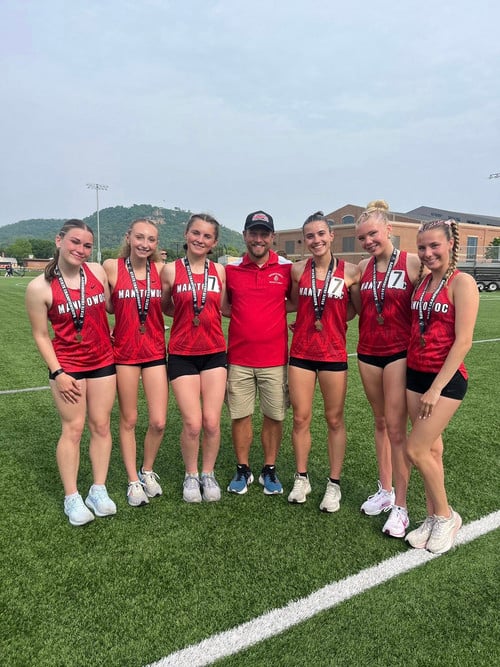 Lincoln track relay with coach and medals