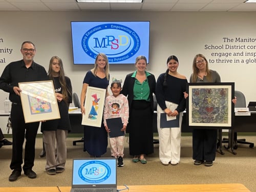 Art teachers and students with their purchased works