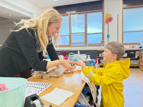 Mrs. Hoffman greets a boy