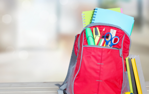 Red backpack with school supplies