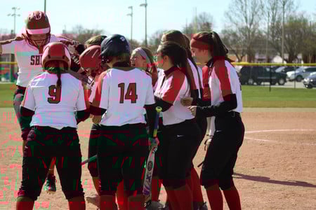 Team huddle on the field